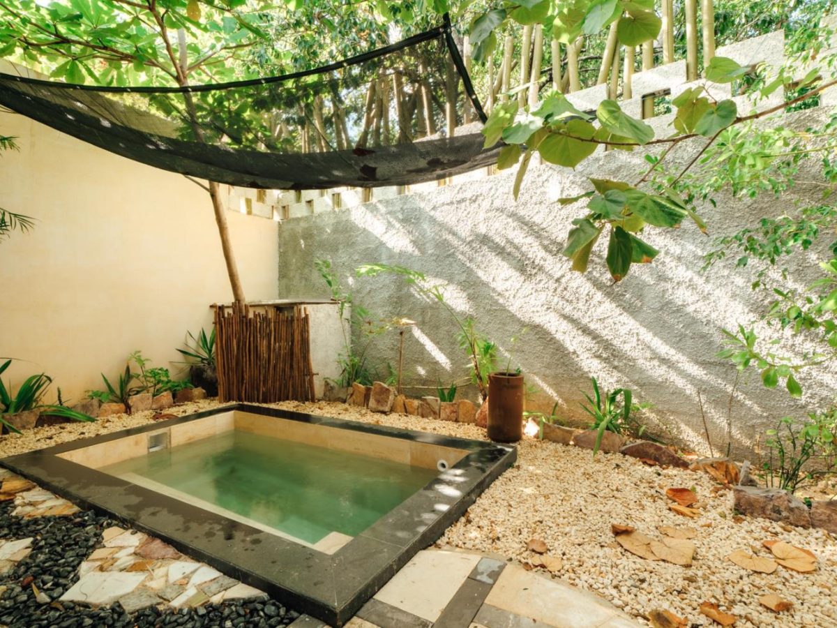 Private plunge pool in the garden of a suite at ARKA Tulum