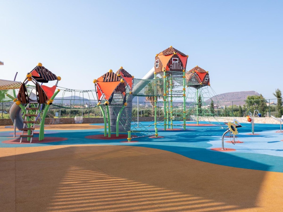 Splash play area with tube slides and climbing towers at Lyttos Beach in Anissaras, Crete