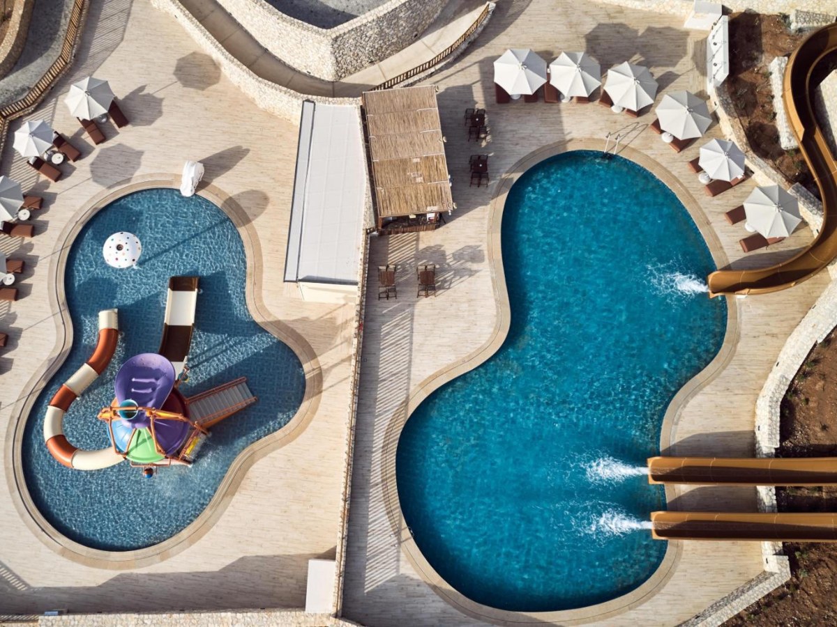 Overhead view of the slide pools at The Royal Senses Resort & Spa in Panormo, Crete