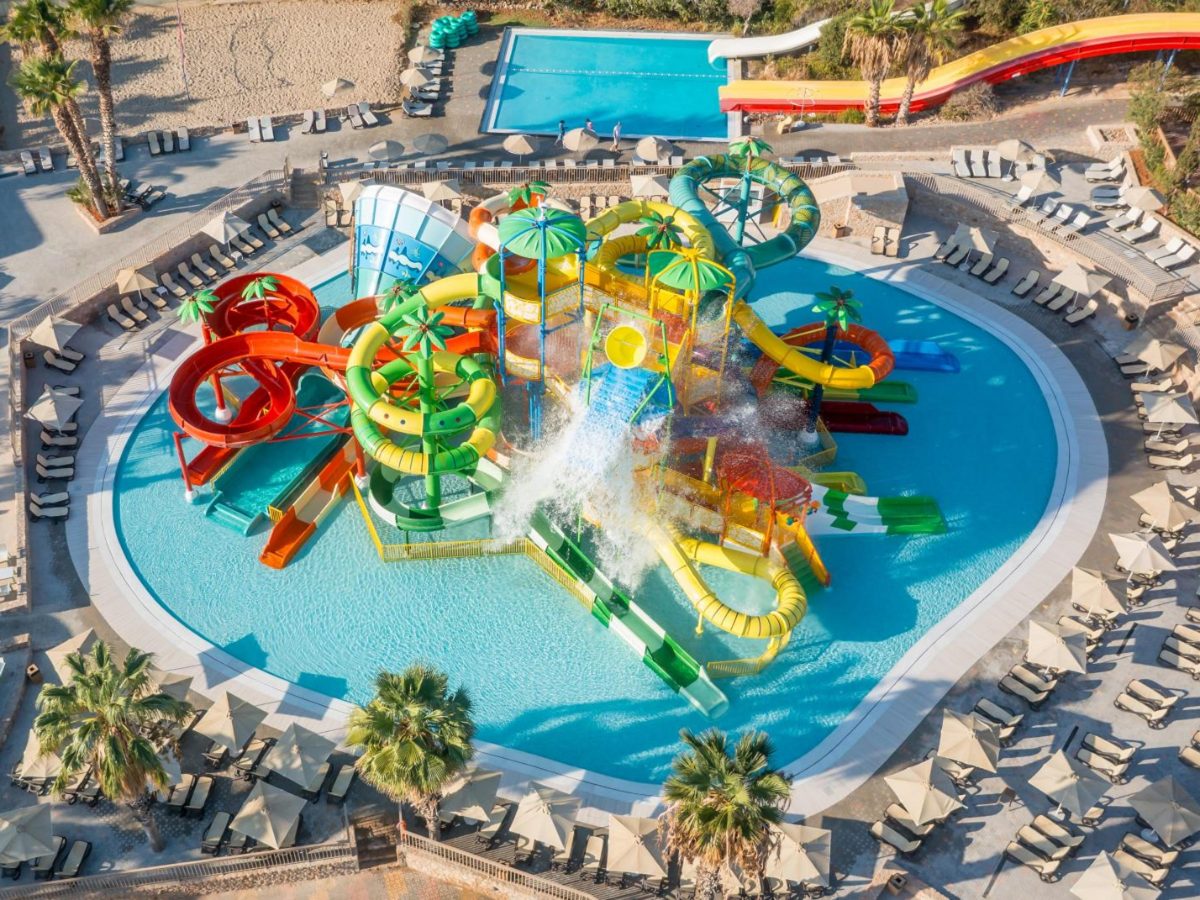 Aerial view of a kids slide pool at Star Beach Water Park next to Star Beach Village in Hersonissos
