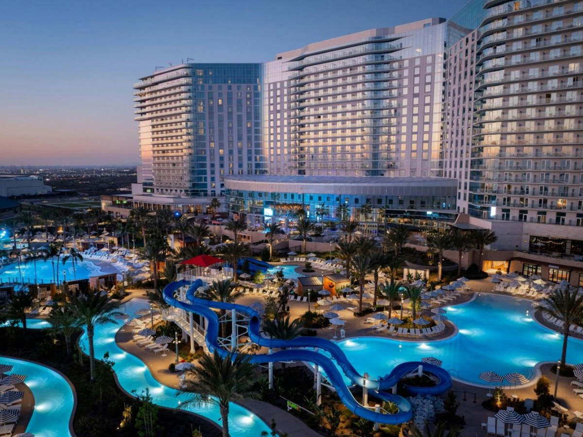 Blue water slides winding over the pools at the Gaylord Pacific Resort water park in Chula Vista at dusk