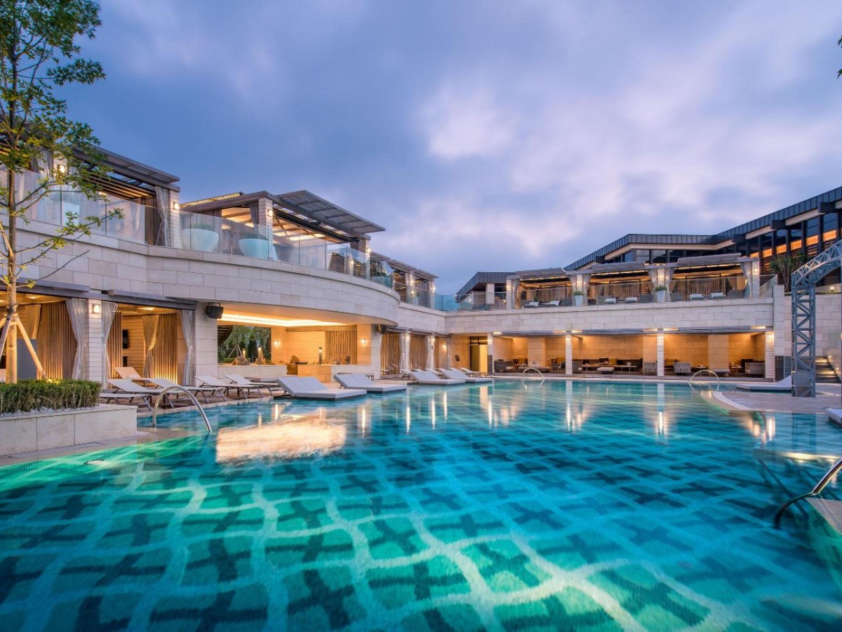 Outdoor pool and building at Paradise City
