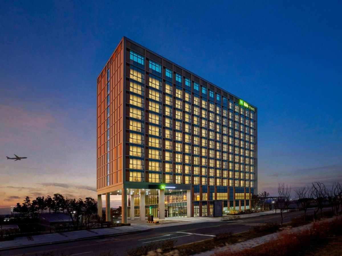 Exterior of ibis Styles Ambassador Incheon Airport at dusk