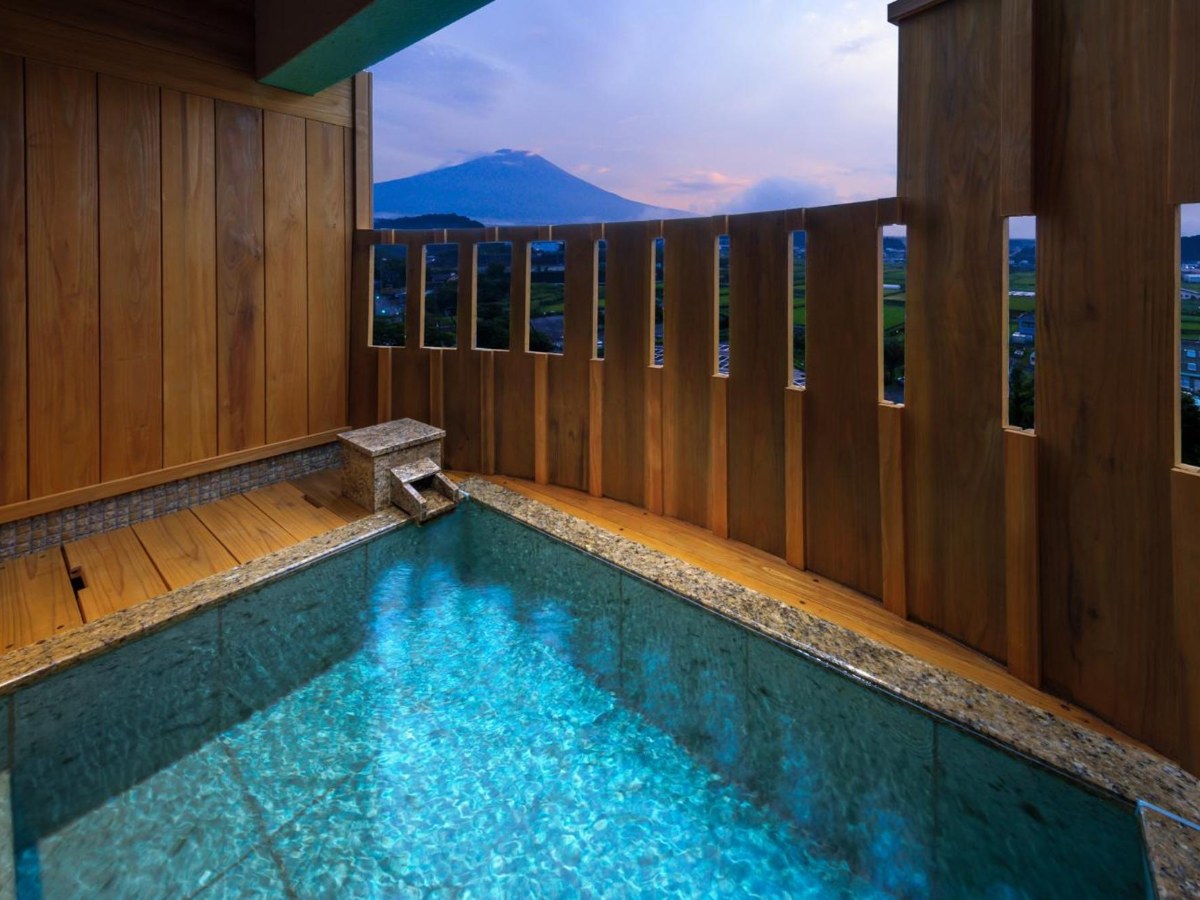 Private open-air bath with Mt Fuji behind at Fujisan Onsen Hotel Kaneyamaen