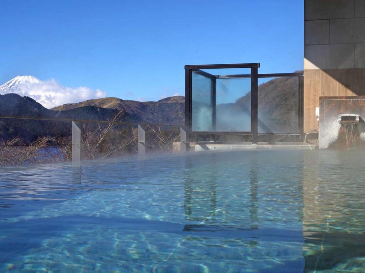 Infinity-edge open-air bath with Mt Fuji behind at Ryuguden, Lake Ashi