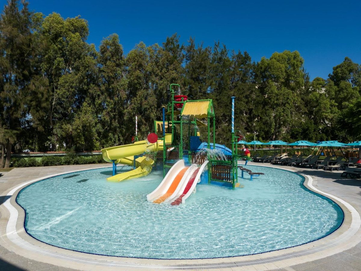 Slide pool among pine trees at Kaya Palazzo Golf Resort