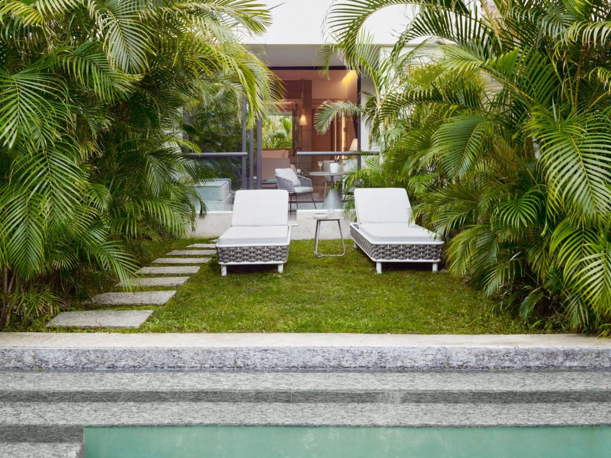 Garden terrace stepping down to the river pool at SLS Playa Mujeres