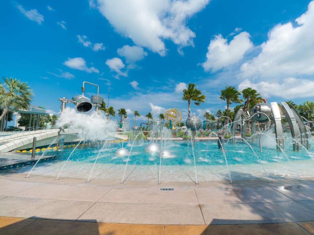 Splash pool with a water slide tube at Grande Centre Point Pattaya