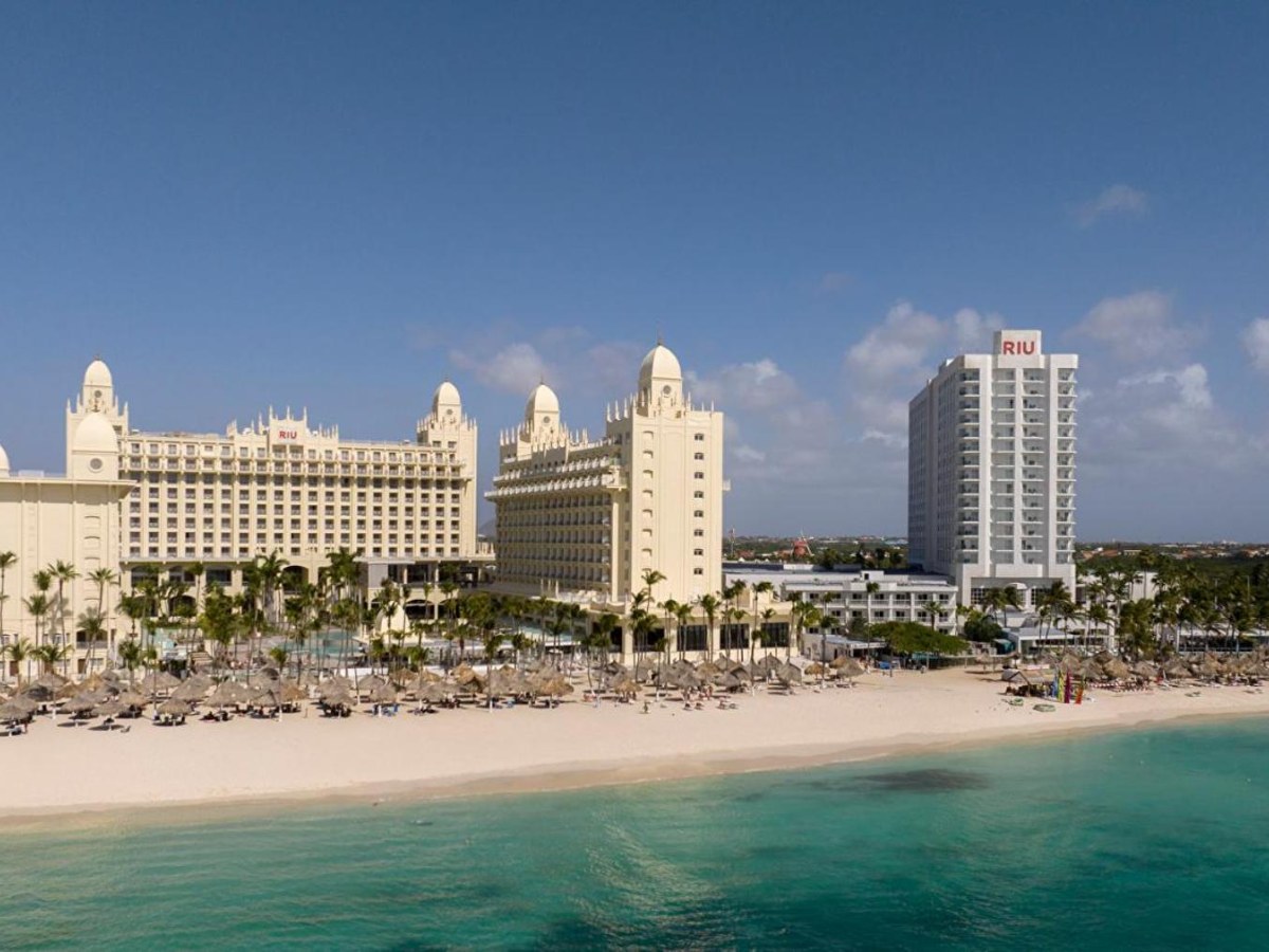 Resort towers and the beach at Riu Palace Aruba seen from the water