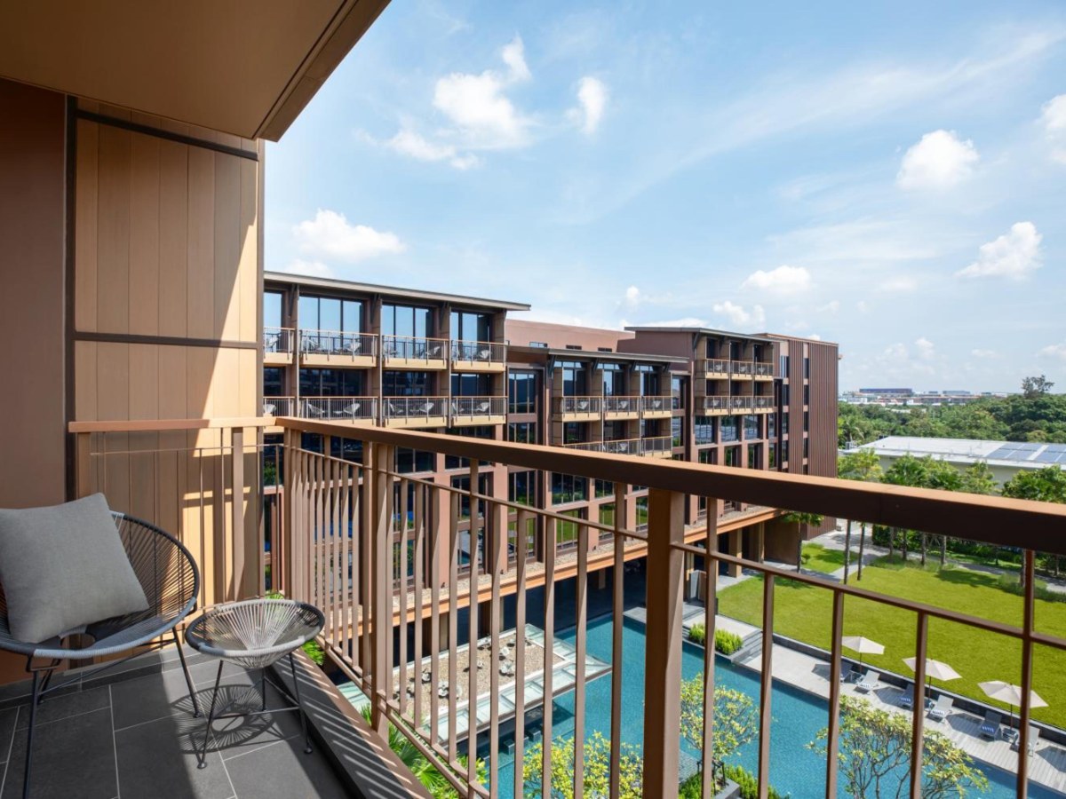 Balcony view over the pool at Courtyard by Marriott Bangkok Suvarnabhumi Airport