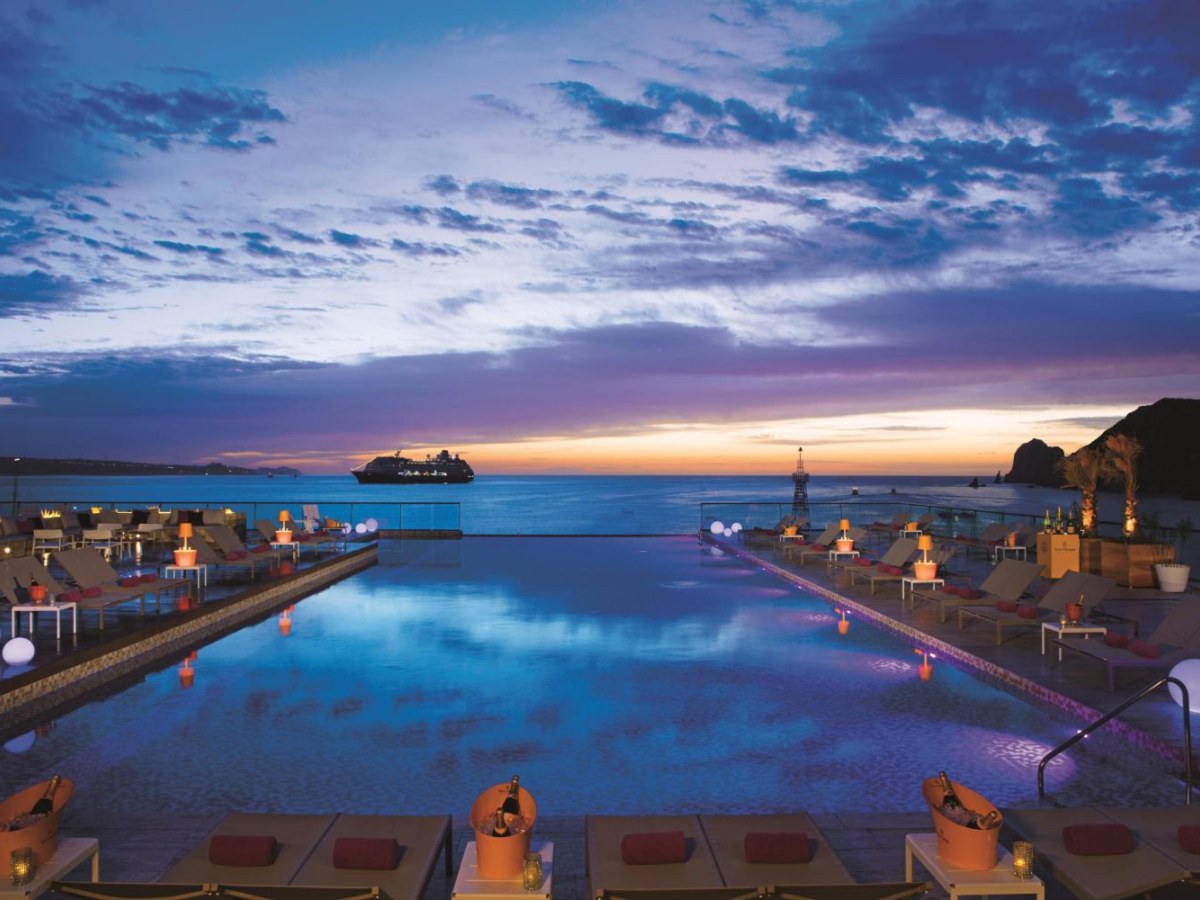 Infinity pool at dusk facing the ocean at Breathless Cabo San Lucas