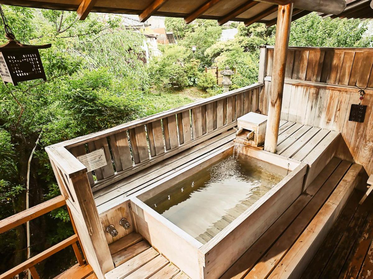 Open-air wooden bath on the balcony of a Shin Kadoya Superior Japanese-style room