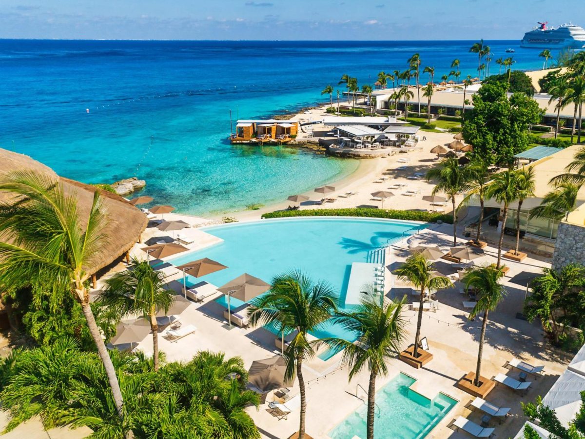Pool and white-sand beach beside the sea at Presidente InterContinental Cozumel