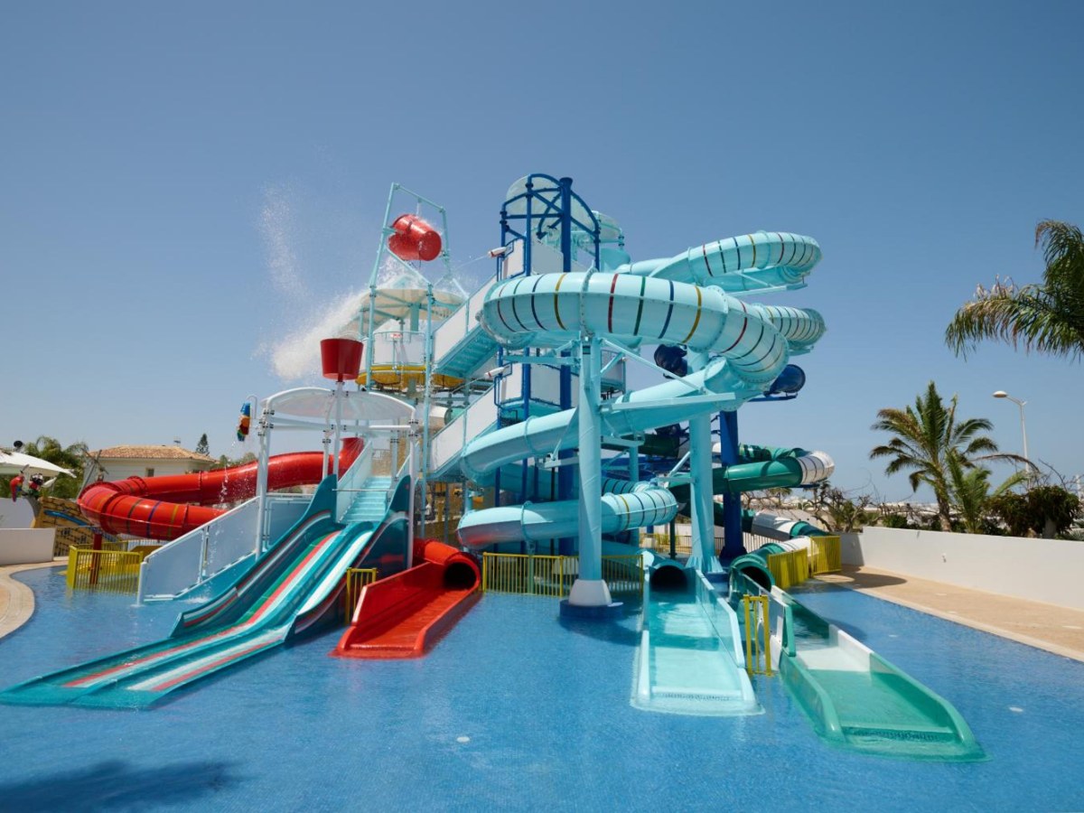 Twisting water slides above the splash pool at Sunrise Oasis Hotel & Waterpark in Protaras