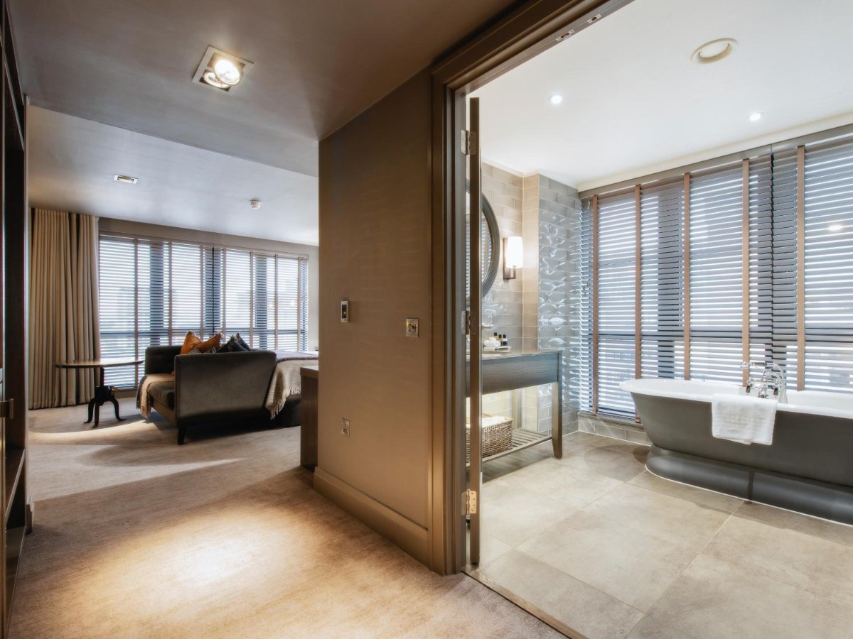 Freestanding bath by the window in a Signature Suite at Dakota Glasgow