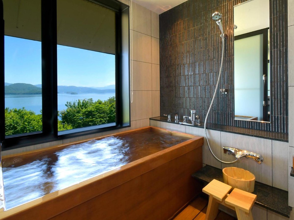 Cypress onsen bath with a lake view in a Deluxe Twin Room at Hotel Premium Lake TOYA