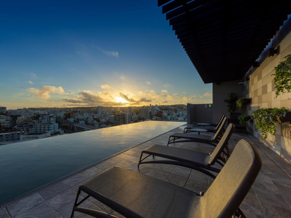 Rooftop infinity pool at Hewitt Resort Naha at sunset