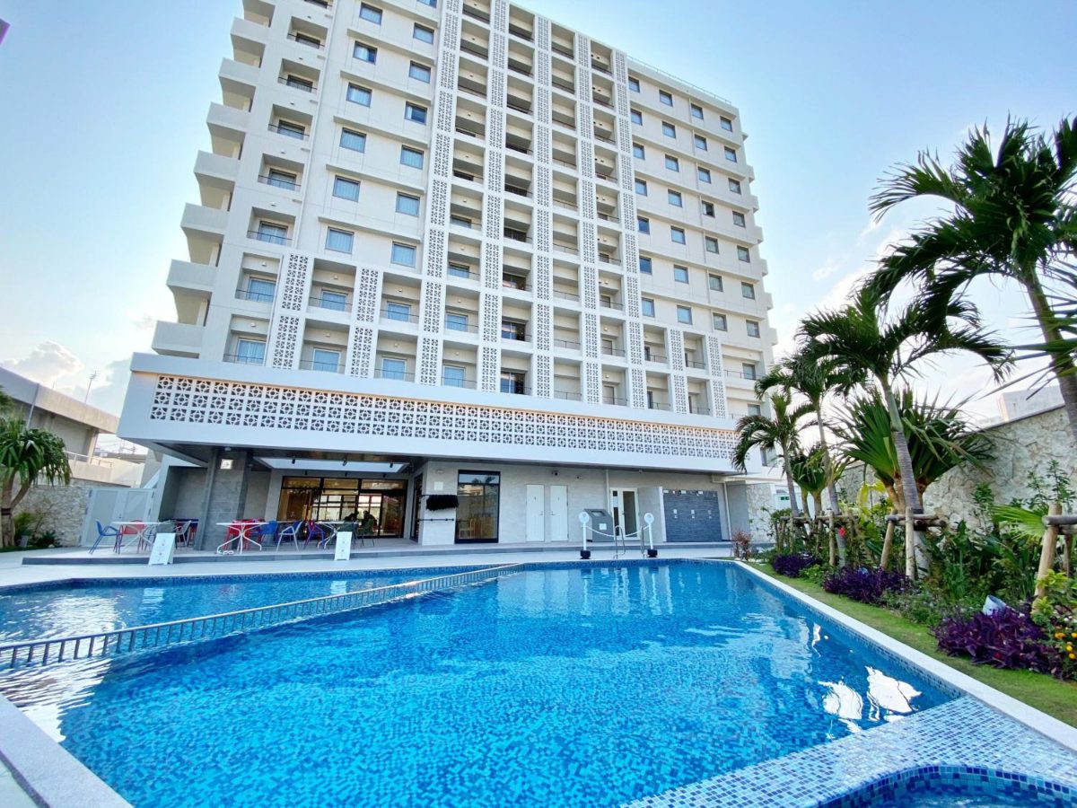 Okinawa Hinode Resort & Hot Spring tower above the outdoor pool