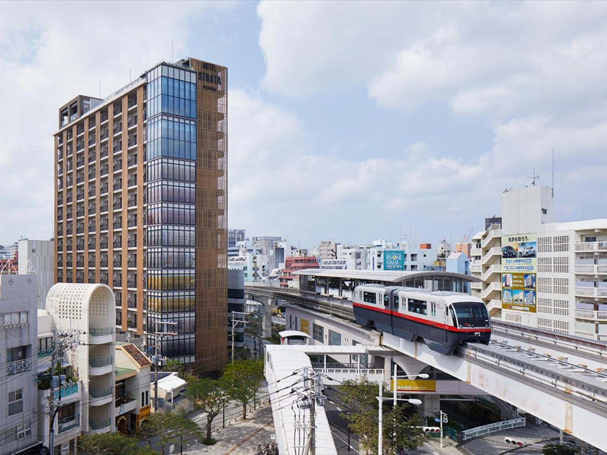 Hotel Strata Naha tower beside the monorail line