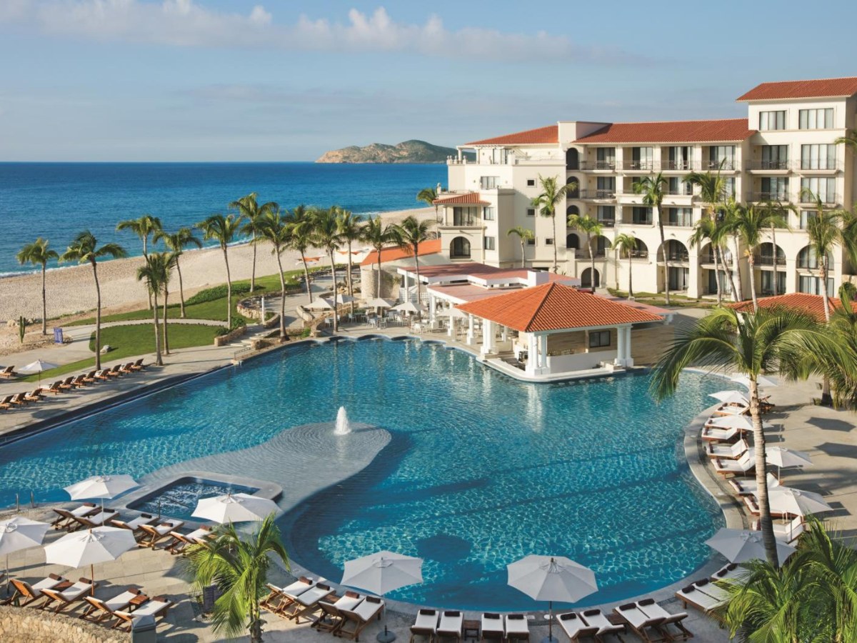 Large resort pool beside the beach at Dreams Los Cabos