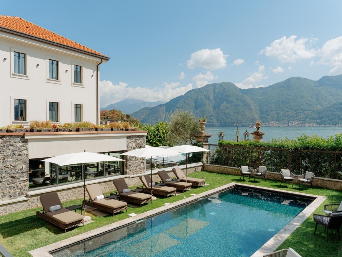 Lake-view pool with loungers at MUSA Lago di Como in Sala Comacina