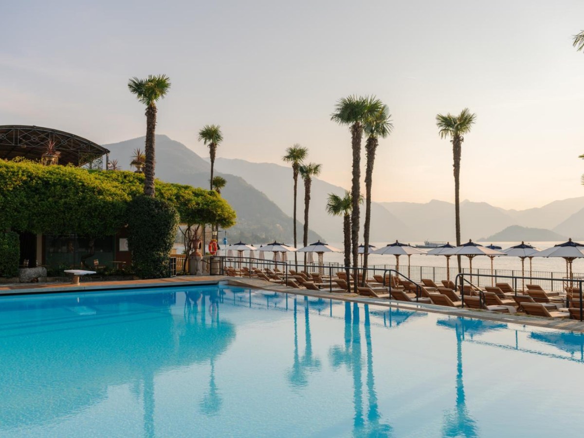 Lakefront pool with palm trees at Grand Hotel Villa Serbelloni in Bellagio