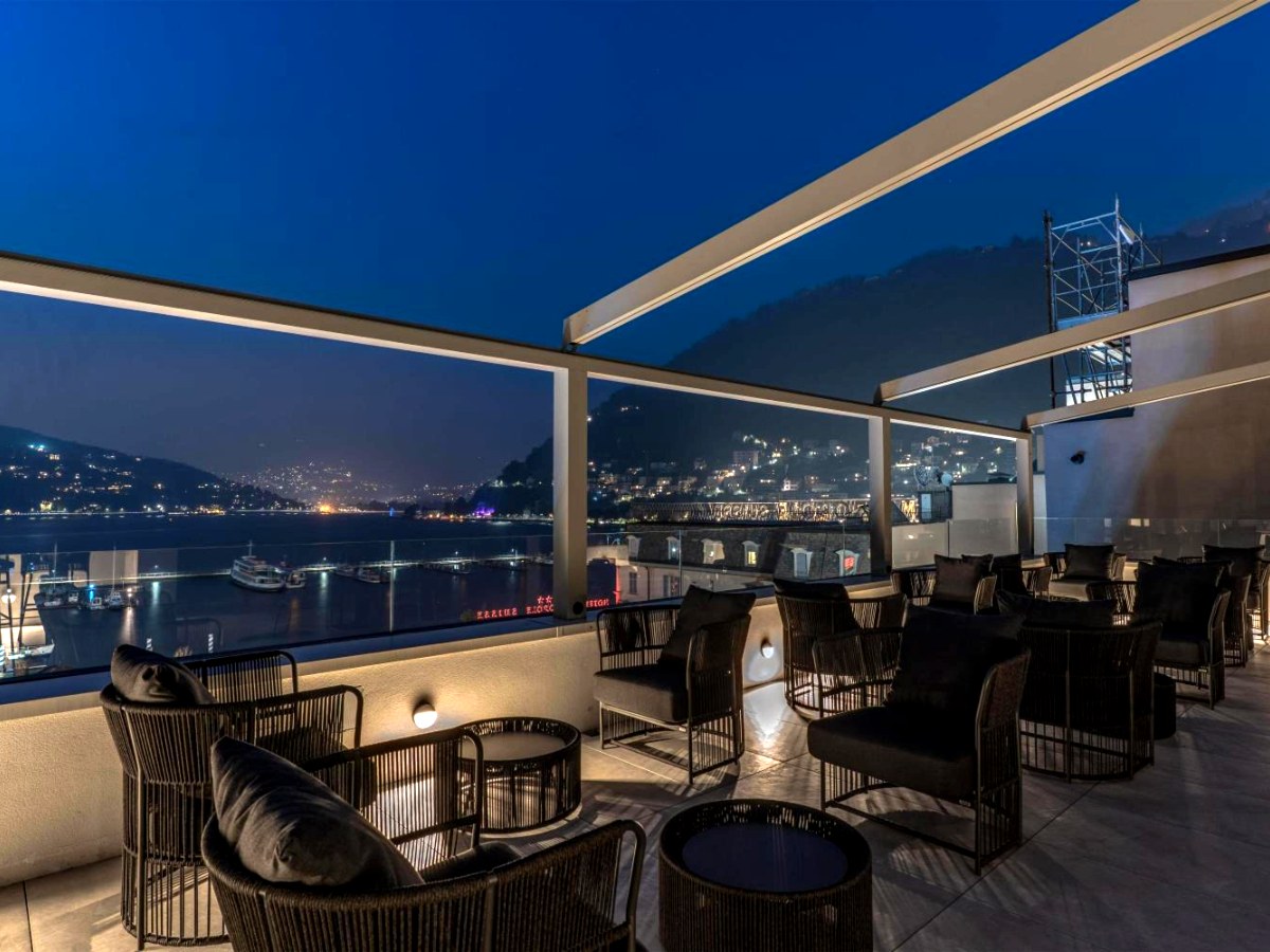 Lumi rooftop bar at dusk above Como's lakefront at Palazzo San Gottardo