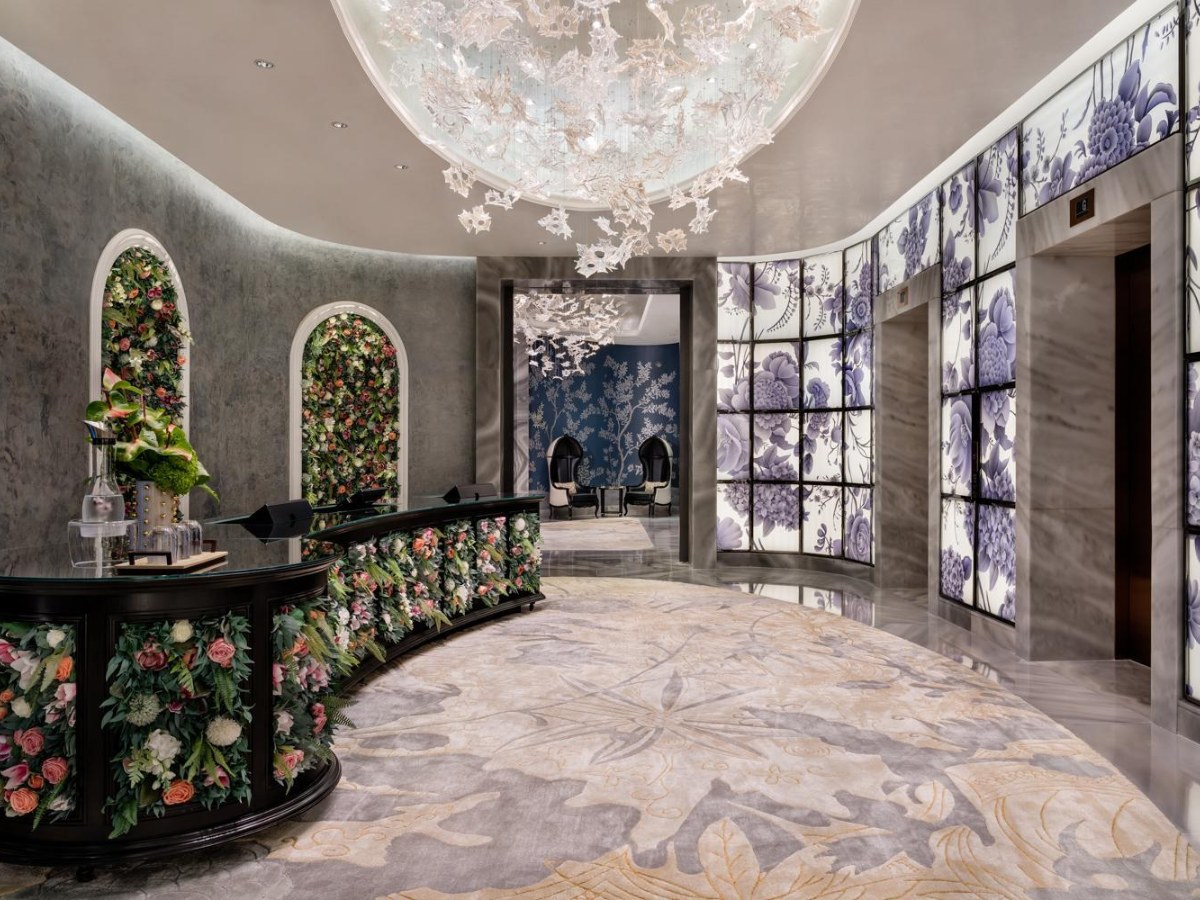 Lobby with a large chandelier and flowers at Grand Lisboa Palace Macau