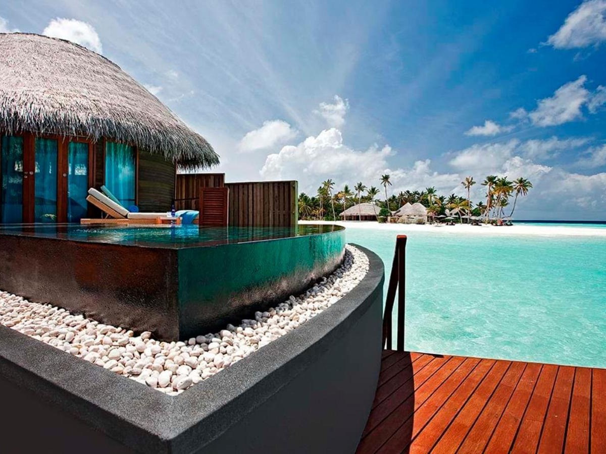 Water villa with a private pool over the lagoon at Constance Halaveli