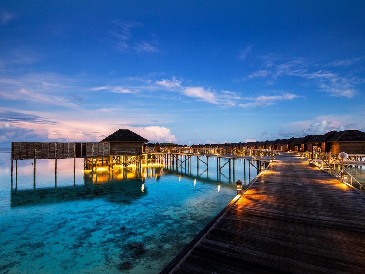 Deluxe Water Villa with private pool at dusk at Lily Beach Resort and Spa