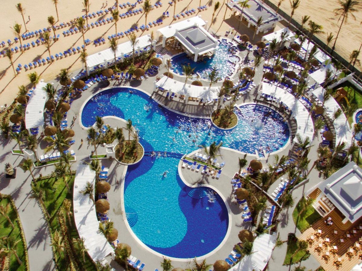 Aerial view of the beachfront pools and water park area at Hotel Riu Emerald Bay