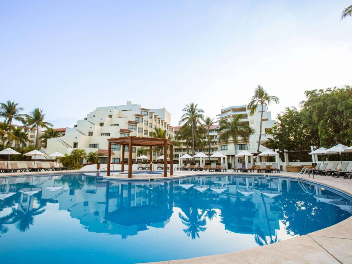 Curved pool with a gazebo at Occidental Nuevo Vallarta