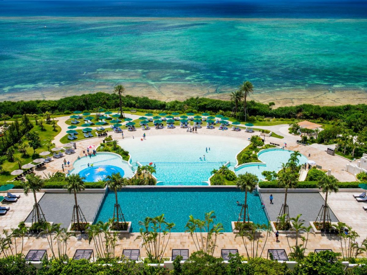 Outdoor pools at Hotel Monterey Okinawa Spa & Resort above the reef lagoon