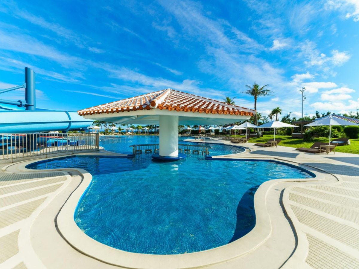 Pool and gazebo with the sea beyond at Sheraton Okinawa Sunmarina Resort
