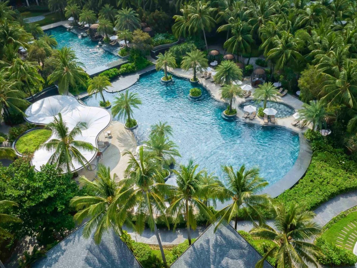 Aerial view of the resort pools among palm trees at InterContinental Phu Quoc