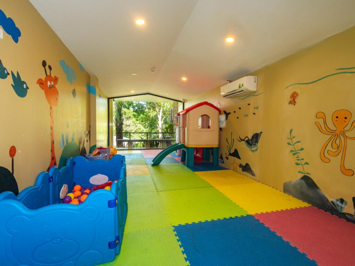 Children's play room with a slide and ball pit at Lahana Resort