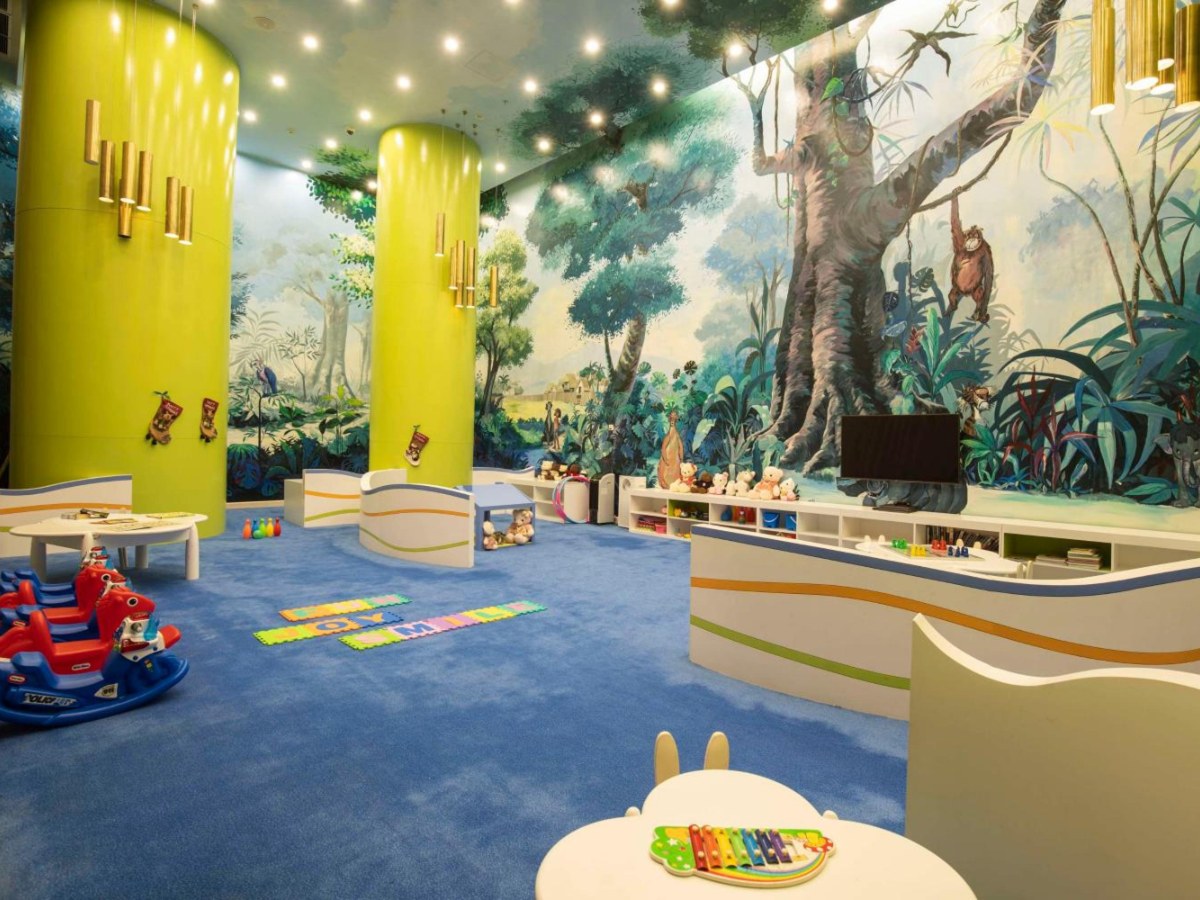 Children's play room with a tree mural at Radisson Blu Resort Phu Quoc
