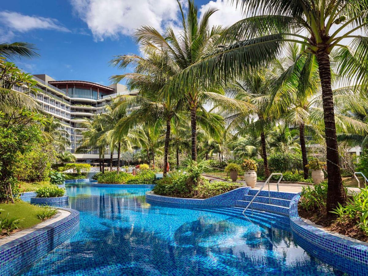 Lagoon pool with palm trees in front of Best Western Premier Sonasea