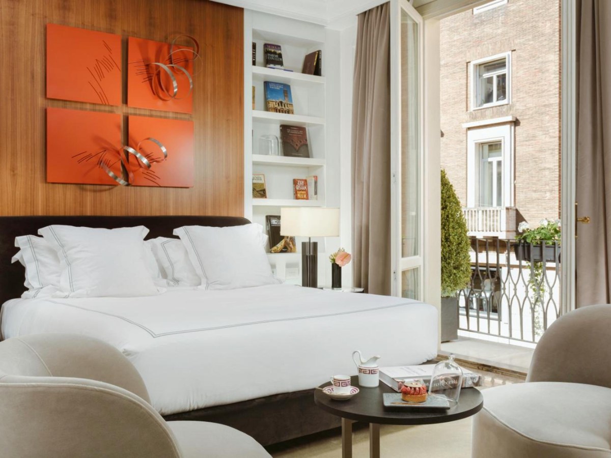 Bedroom of a Suite with Balcony and View at The First Dolce