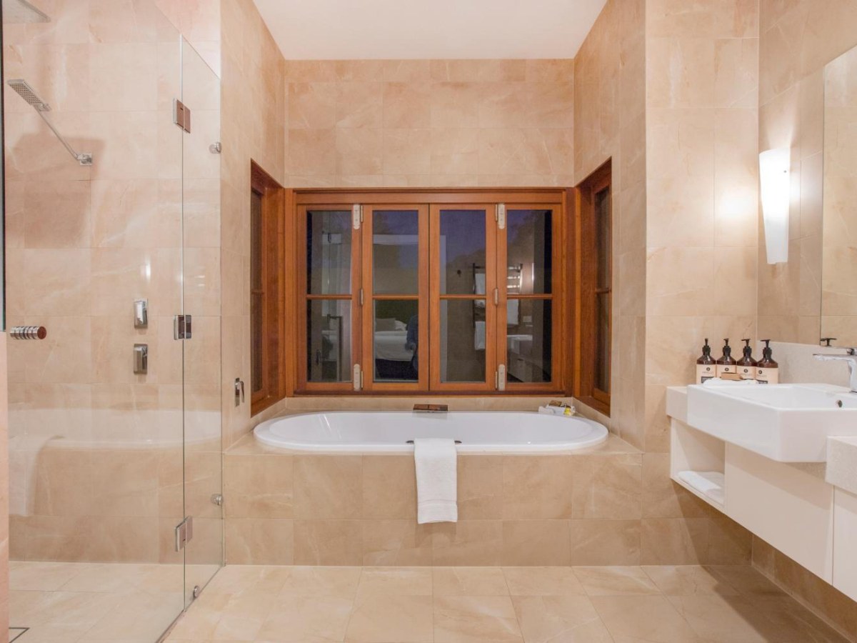 Spa bath under the window in a Luxury Spa Suite bathroom at Spicers Vineyards Estate