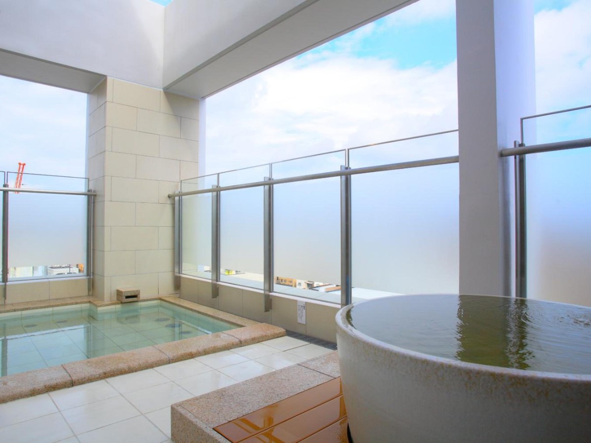 Open-air tsubo bath and stone bath at Spa Hotel Alpina Hida Takayama